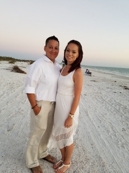 two brides on the beach after wedding ceremony 